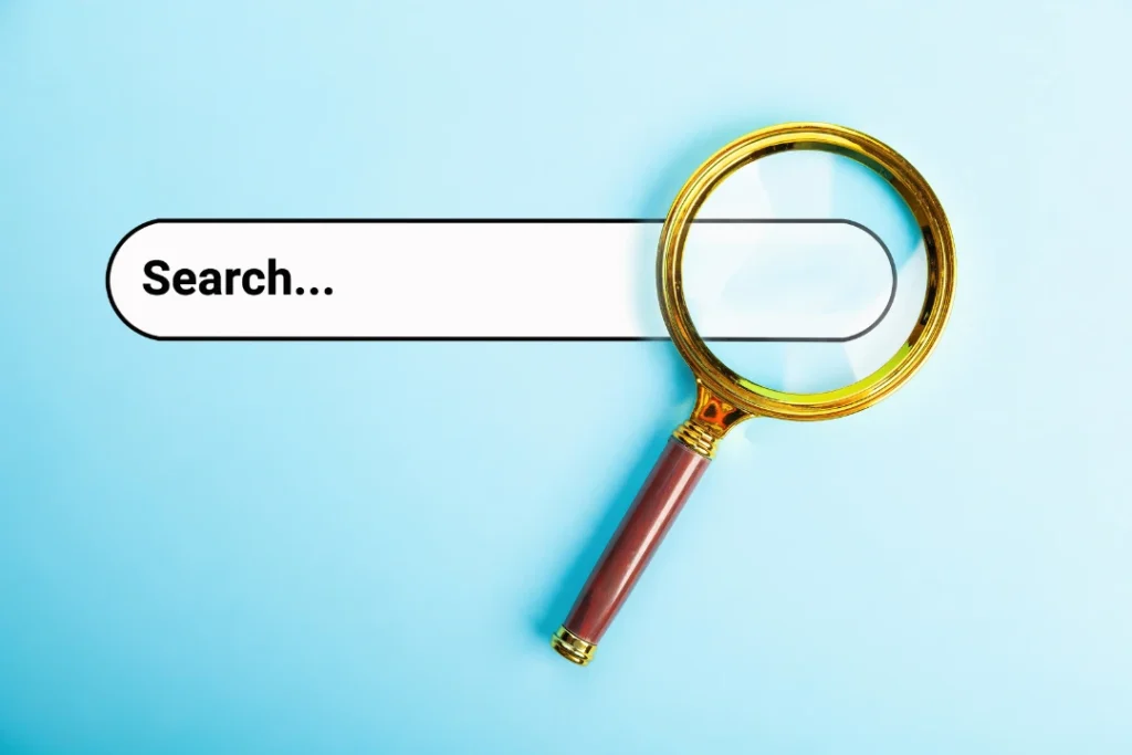 Magnifying glass on a search bar.